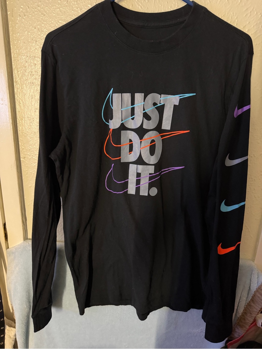 Nike Black Long Sleeve 'Just Do It.' Graphic Tee with Multicolor Swooshes